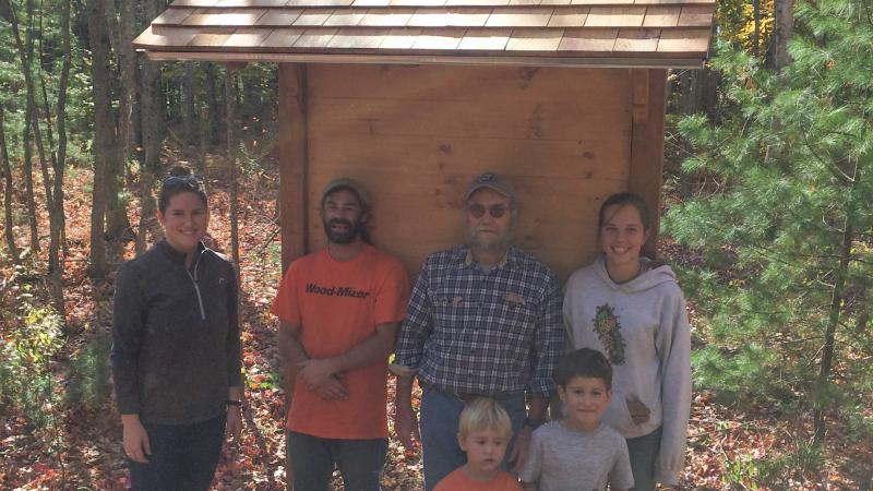Group of volunteers standing along a trail