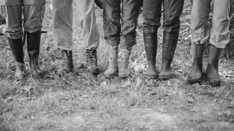 5 pairs of feet wearing boots