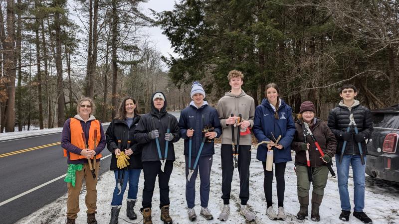 Group of volunteers holding loppers
