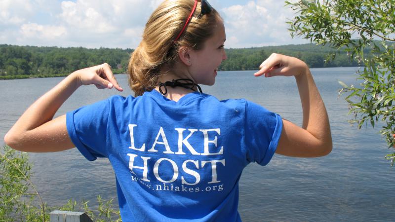 Lake host volunteer wearing a "lake host" shirt
