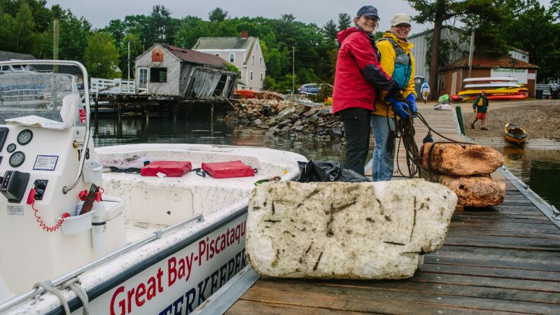 volunteers on a boat dock