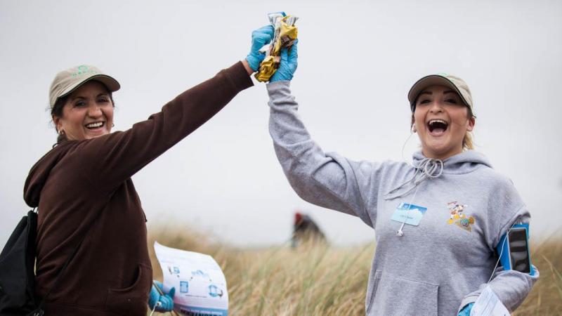 Volunteers high-fiving.