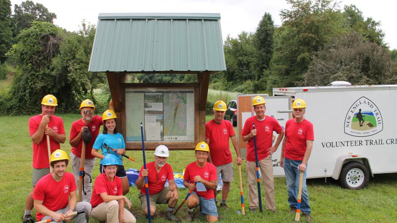 group of volunteers wearing hard hats.