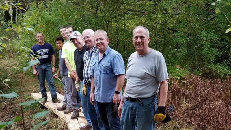 Volunteers lined up on the Bog Bridge.