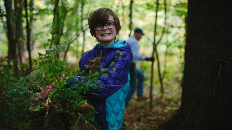 Volunteer pulling invasive plants