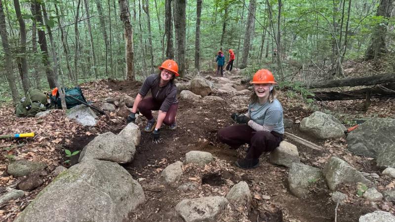 two volunteers on trail