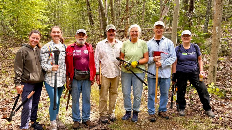 Volunteers with loppers