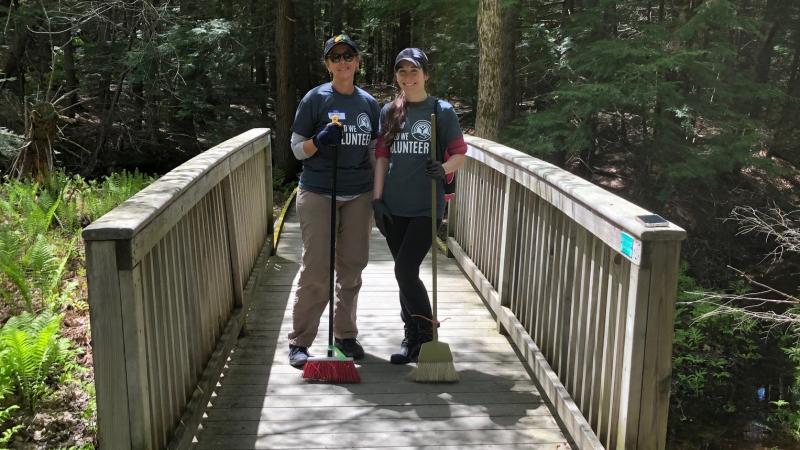 volunteers standing on boardwalk