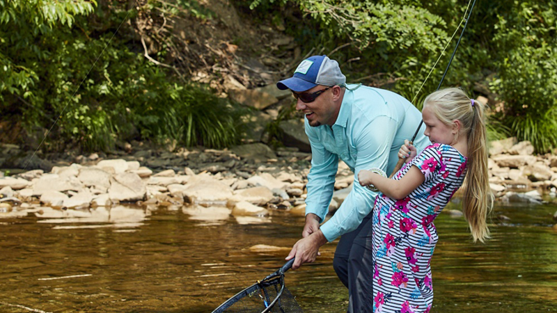 man and child fly fishing