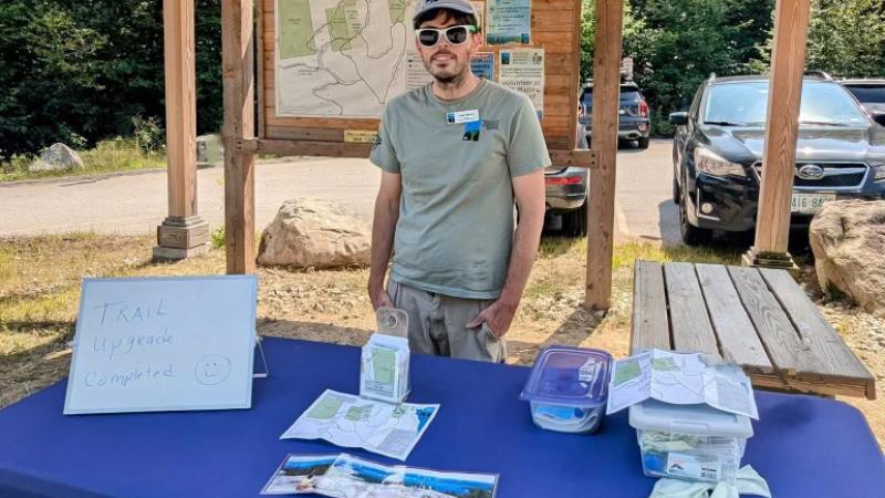 person standing at booth
