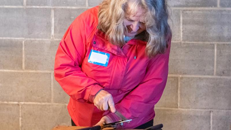 person sharpening tools