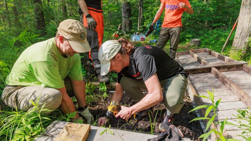volunteers building a bridge