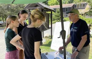 volunteer directing hikers