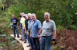 Volunteers lined up on the Bog Bridge.