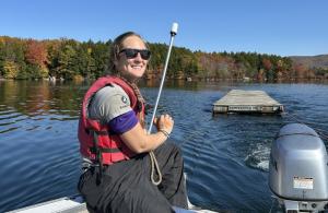 volunteer towing a dock in water