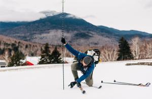 person measuring snow depth