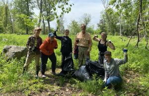 group with bags full of pulled garlic mustard