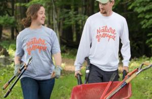 Nature Groupie interns with wheelbarrow