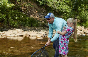 man and child fly fishing