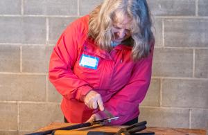 person sharpening tools