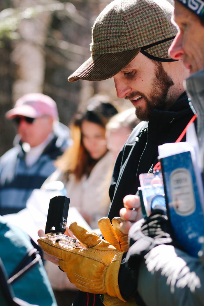 volunteer using a compass