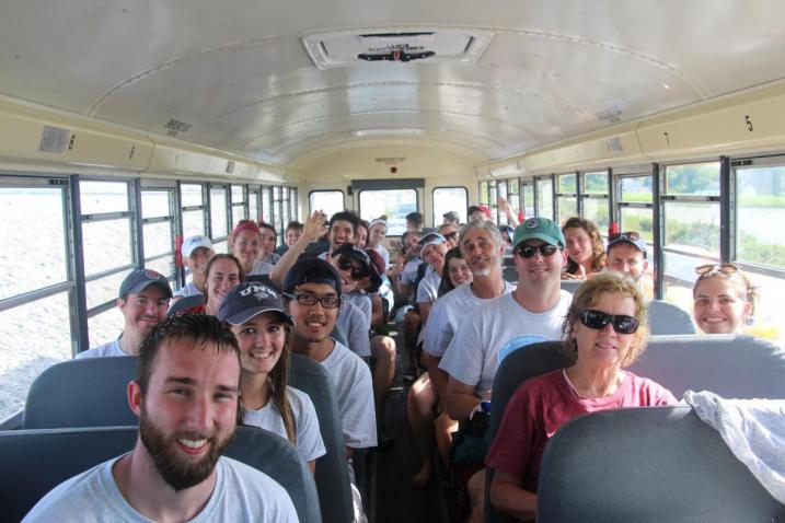 Group of volunteers riding on a bus