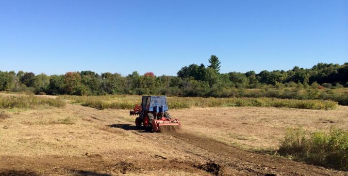 Using tractor to smooth out the field road/path.