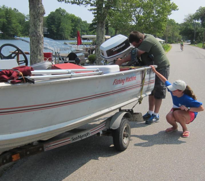 Lake host inspecting boat