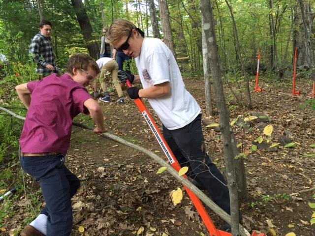 Oyster River High School students using weed wenches