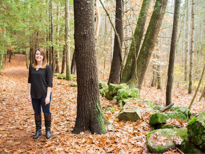 Holly Fosher standing in a forest