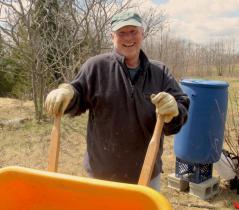 volunteer with wheelbarrow