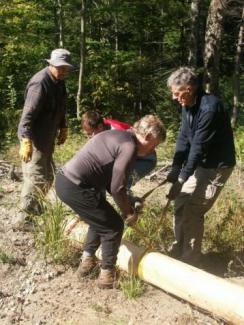 volunteers doing trail work