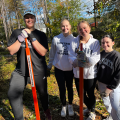 volunteers with weed wrench