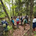 group standing by river bank