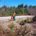 volunteers smiling standing along road