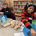two volunteers packing seeds