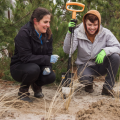 two people standing with shovel