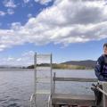 person driving boat on lake