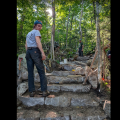 person standing on stone steps