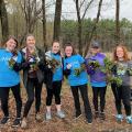 group of volunteers with pulled garlic mustard