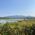 view of mountains across wetland