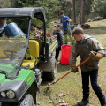 kids using rakes to clear debris