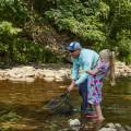 man and child fly fishing