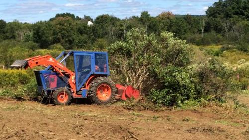 tractor with its mower attachments