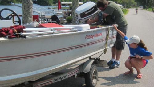 Lake host inspecting boat